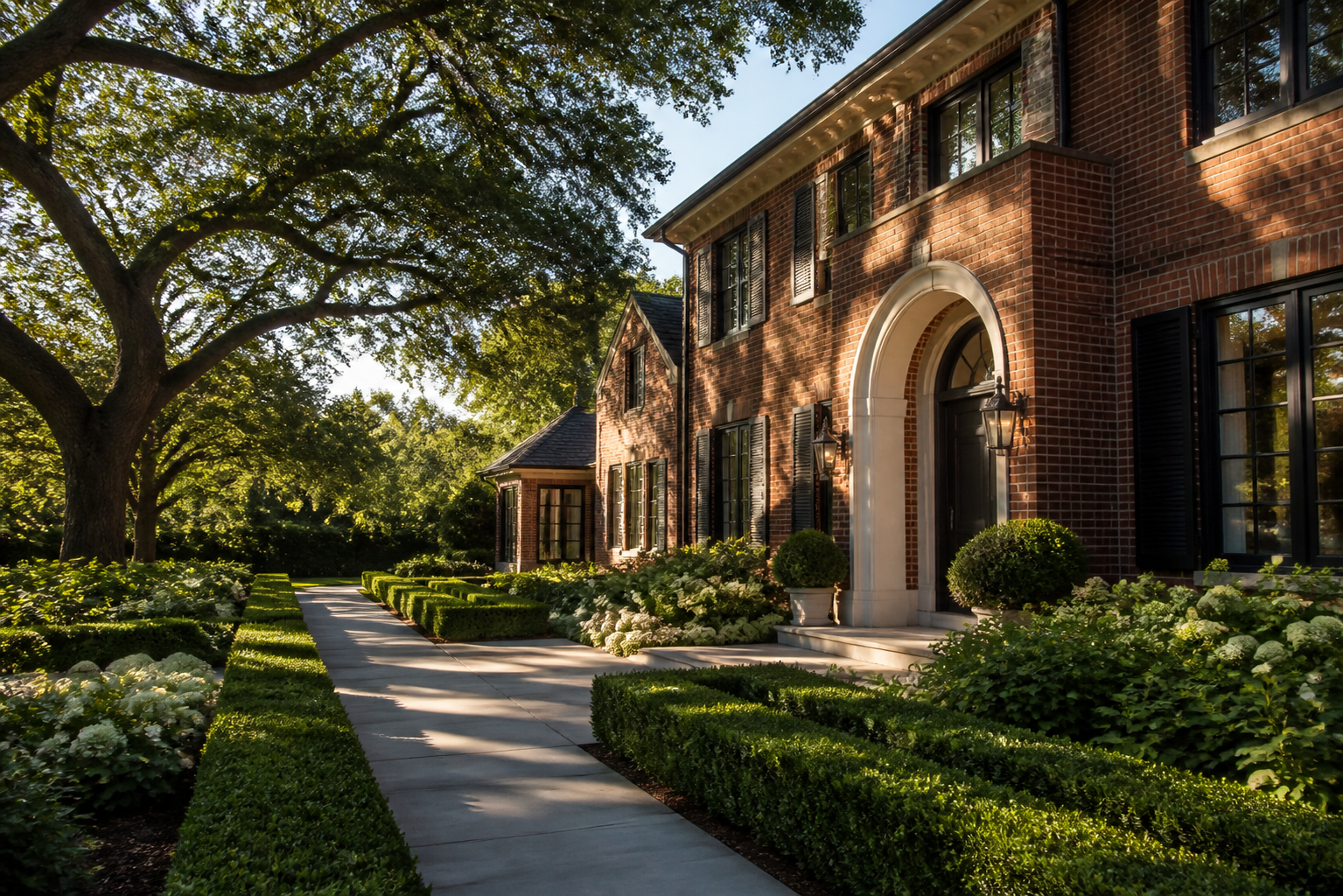 A renovated southern brick house with mature trees